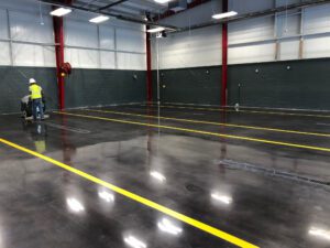 a shiny and clean floor with yellow lines