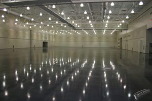 an empty hall with lots of lights