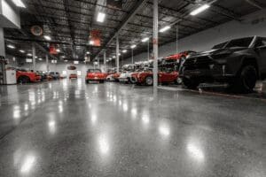 a car showroom floor with light reflection on it